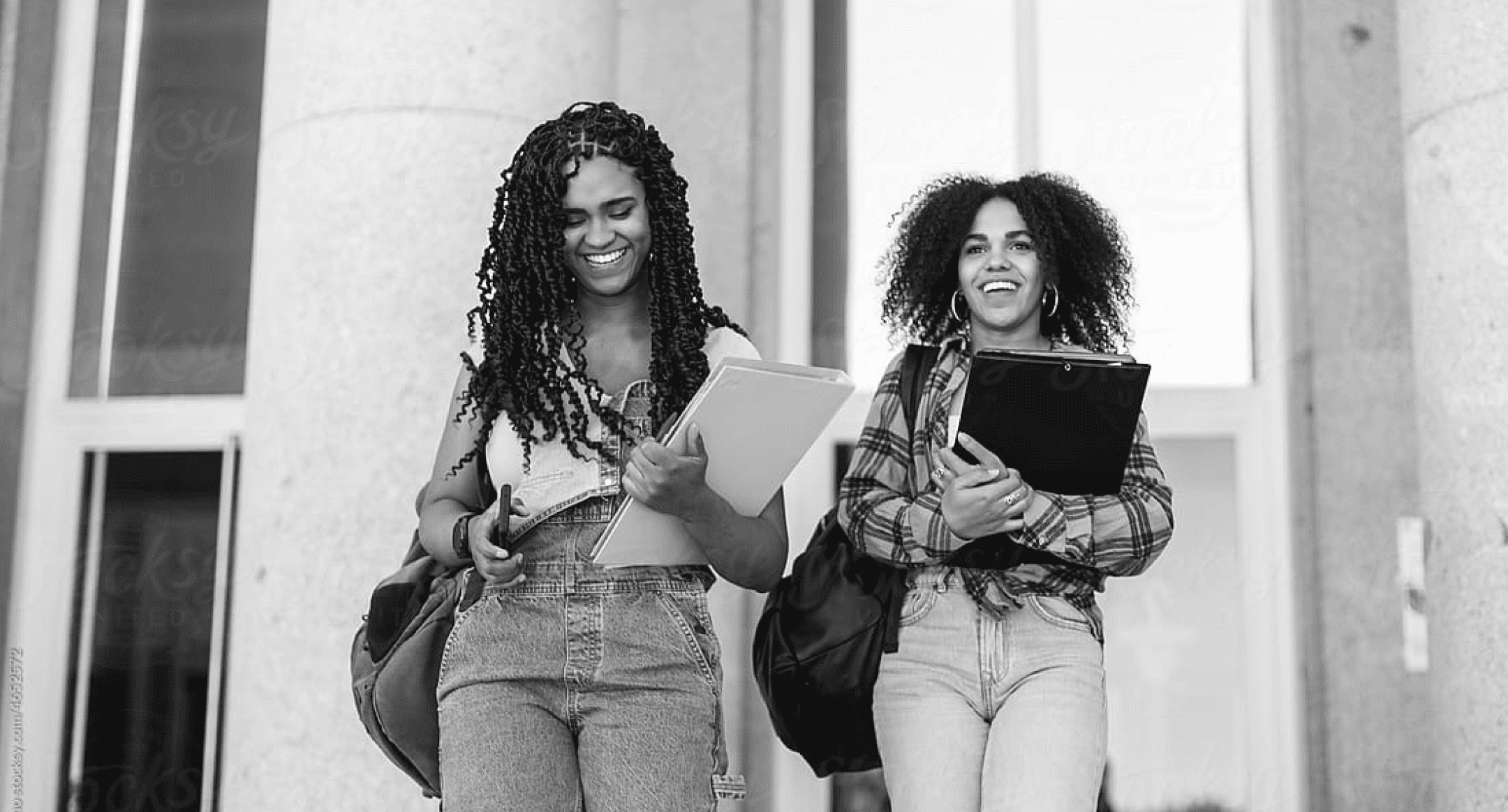 2 happy smiling university girls 